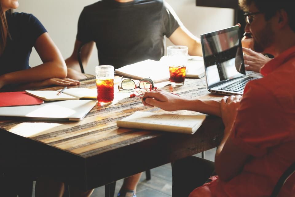Team collaborating around a work table
